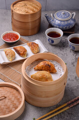 Kuotie is the Chinese-Indonesian interpretation of guotie. It basically tastes very similar to guotie, the main difference is that kuotie is much more garlicky in flavour. 
