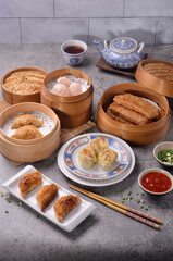  A Chinese dish of small steamed or fried savory dumplings containing various fillings, served as a snack or main course.
