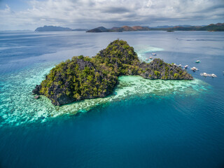 Malwawey Coral Garden in Coron, Palawan, Philippines. Mountain and Sea in background. Tour A.