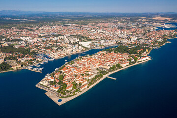Aerial shot of Zadar old town, famous tourist attraction in Croatia. Waterfront aerial summer view, Dalmatia region of Croatia. - obrazy, fototapety, plakaty