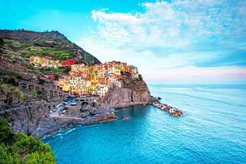 Beautiful magic colorful summer landscape on the coast of Manarola in Cinque Terre, Liguria, Italy.  Exotic amazing places. Popular tourist atraction.