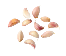 A collection of garlic cloves isolated on a flat background.