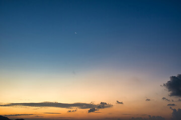 Evening golden hour sky with moon