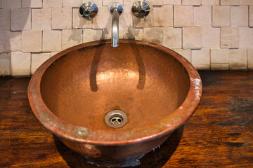 old vintage copper sink at the takamaka rum distillery 