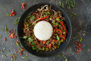 spicy beef with rice in a frying pan, asian cuisine, asian restaurant