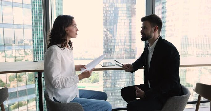 Client review contract details feels satisfied with terms shake hands sales manager or bank advisor, got loan gesturing express respect, finish formal meeting, make deal in modern office. Agreement