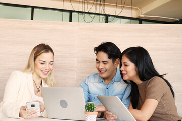 Full concentration at work. Multi-ethnic business people sitting and discussing in the office, best...