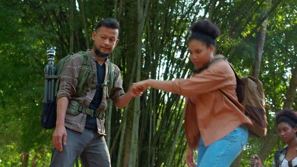 Adult man and teenager woman hiking and backpack with happy and leisure in the forest, walking and adventure on vacations weekend with relax and challenge, activity trekking and travel trip on summer.