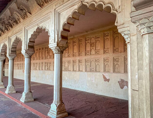 The famous red fort in the city of Agra, India. Tourists visit a popular tourist attraction.