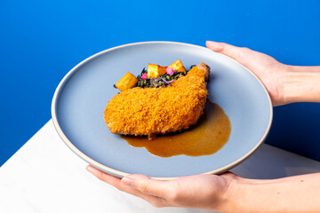 fried chicken thigh with vegetable and sauce