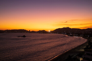Mexico, Acapulco resort beaches and sunset ocean views near Zona Dorada Golden Beach zone.
