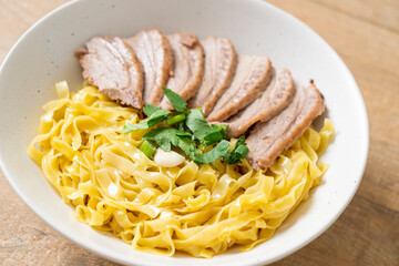 dried duck noodles in white bowl