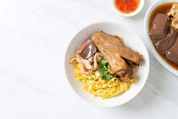 Egg noodles served dry with braised duck