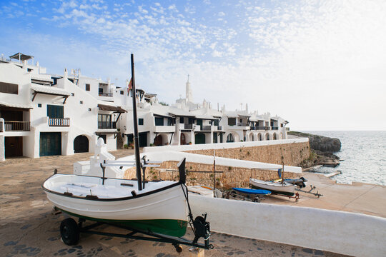 Binibeca town, Menorca island, Spain, Beautiful view of old town with boat