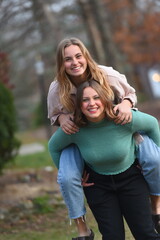 Fototapeta premium Teen Girls Piggyback Fun