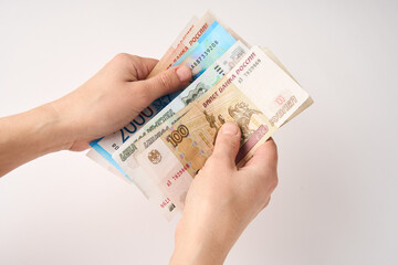 Hands counting Russian money bills, close-up
