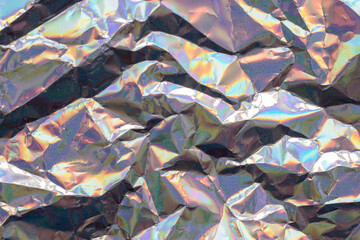 Abstract trendy holographic background. Fantasy texture in soft colors and irregular wrinkled shapes