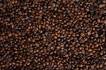 photo macro close up texture of roasted coffee beans dark, can be used as a background.