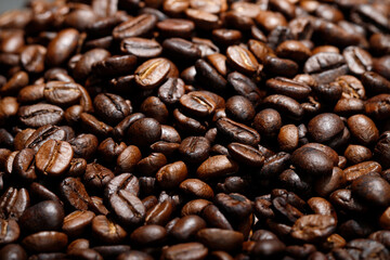 photo macro close up texture of roasted coffee beans dark, can be used as a background.