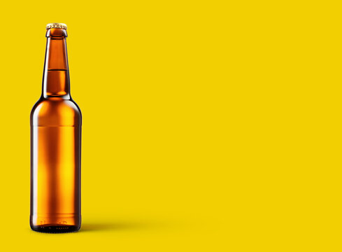 Golden bottle of beer on yellow background