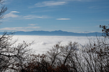 Sea of white clouds above Rioja Alavesa valley as seen from sunny point of view Balcon De La Rioja, Spain in winter