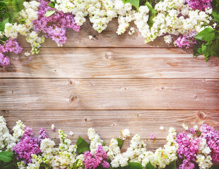 Blooming lilac flowers (syringa vulgaris) on rustic wooden table