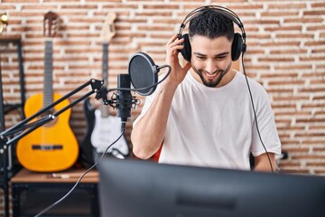 Fototapeta na wymiar Young arab man artist singing song at music studio