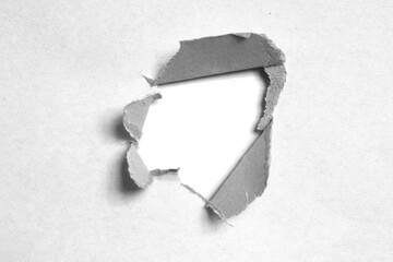ripped hole paper on white background and have copy space