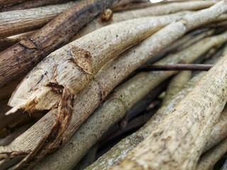 High quality, natural background of stacked teak wood blocks in close up.