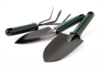 Garden rake and shovel isolated on white background.Gardening tools.Gardening and hobby concept.