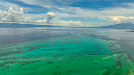 Fototapeta na wymiar Aerial view of sandbar in the blue sea. Seascape with Manjuyod sandbar. Negros, Philippines.