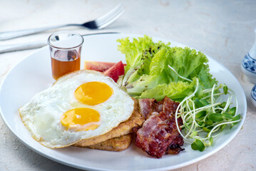 ix dish breakfast salad with fried egg, eggs Benedict, egg burrito, juice, toasted muffins, ham, poached eggs, and delicious buttery hollandaise sauce with fresh salad.