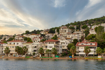 Fototapeta na wymiar View of the mountains of Kinaliada island from Marmara Sea, with traditional summer houses and boats, Istanbul, Turkey