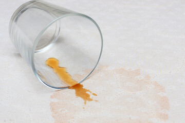 Stains on the mattress of the bed about spilled drink from the glass. The concept of stain removal and cleaning