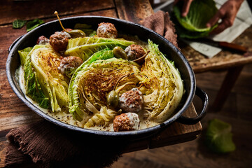 Delicious baked cabbage with meatballs