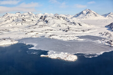 Aerial view of coast with mountains in East Greenland