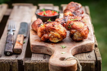 Spicy and hot grilled chicken leg in garden