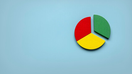 Business report concept.Company financial report.Business charts. Colorful quarter wooden pie chart...