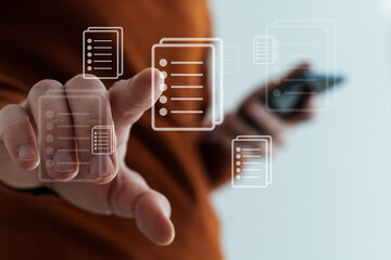 Businessman pressing virtual icons, virtual screen.