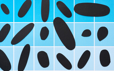 grungy, dirty black paper ovals on scrapbook paper sheet with paint-chip design (blue boxes)