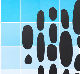 grungy, dirty black paper ovals on scrapbook paper sheet with paint-chip design (blue boxes)