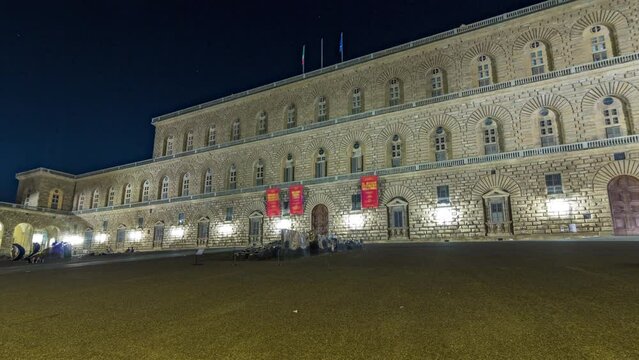 Night view of the palazzo pitti gallery timelapse hyperlapse in the italian city florence. Illuminated facade and entrance