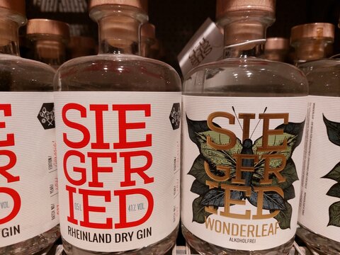 Siegfried Gin and Wonderleaf alcohol free gin bottles in a supermarket