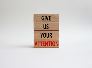 Attention symbol. Concept word Give us your attention on wooden blocks. Beautiful white background. Business and Give us your attention concept. Copy space