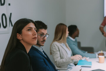 Close up of business colleagues looking at something