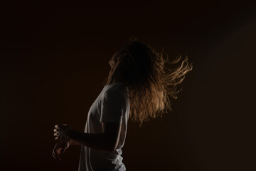 Headbanging with long curly hair