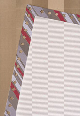 striped scrapbook paper with star cutouts and corrugated cardboard sheets