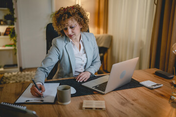 One happy woman work from home or office sit by the desk use laptop