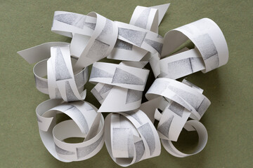 paper coils on rough green paper