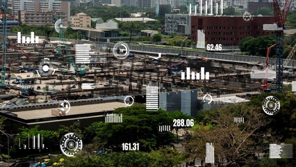 Construction technology concept with alteration graphic over construction site showing concept of automation and remote wireless machine control by using futuristic HUD in a computer software .